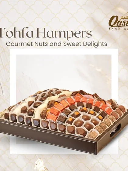 My 'Tohfa' hamper is designed for grand gestures. This large tray is filled with a lavish assortment of gourmet nuts and sweet delights, including various artisanal chocolates and fusion balls, making it a perfect gift for weddings or large celebrations.