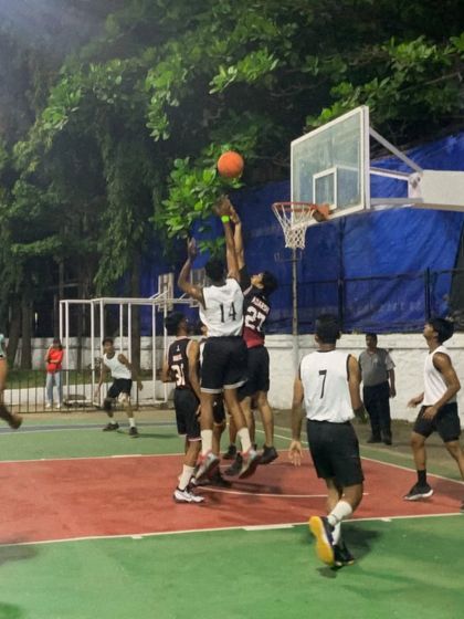 Players from both teams leap for a rebound under the basket. These high-stakes moments are what our training prepares us for.