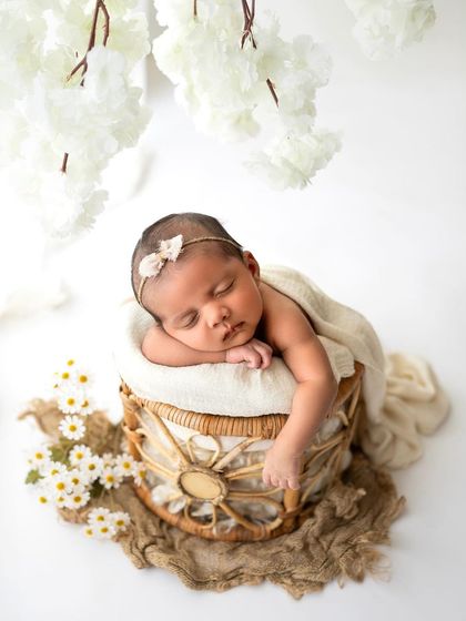 Adding some hanging white blossoms to the boho setup creates a bit more dimension and a touch of whimsy.