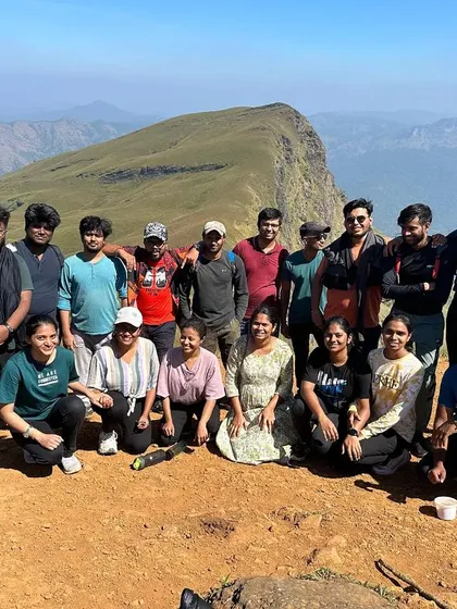 The New Year's trekking batch posing for a group photo on the sunny slopes of Nethravathi.