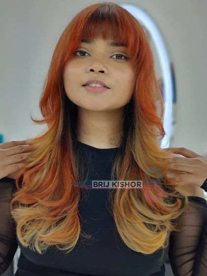 The client looking happy and stylish with her new Y2K-inspired hair.