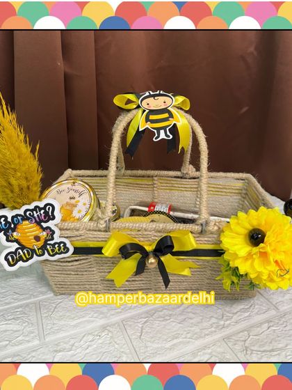 A 'Dad to Bee' themed hamper in a jute basket, a fun and unique idea for a baby shower.