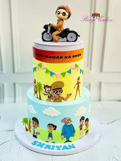 A Little Singham cake for a 5th birthday celebration, complete with an edible figurine of the hero on his bike.