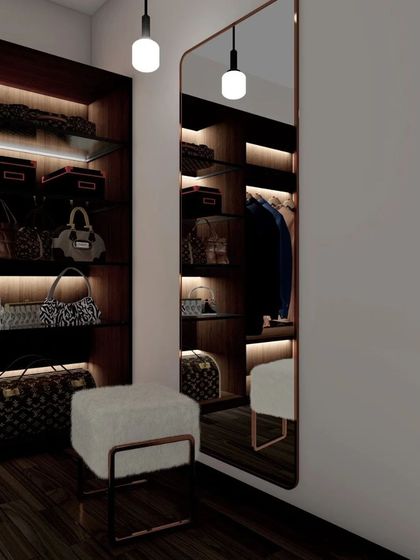 A duplicate of 101, showcasing the moody and luxurious feel of the walk-in closet with its warm lighting and organized storage.