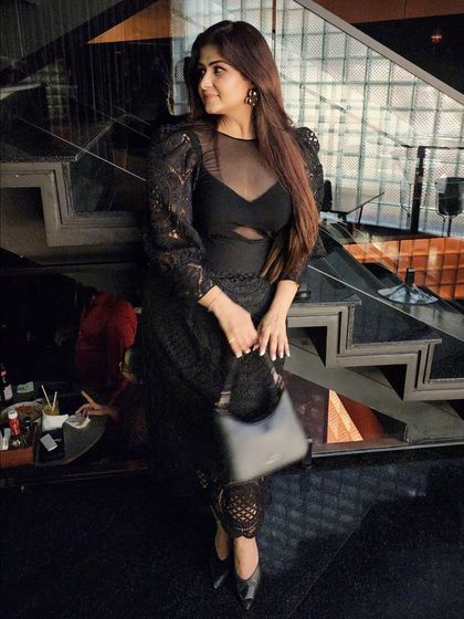 Another angle of the black dress, highlighting the puff sleeves and cutout details. Every element of an outfit contributes to the story you tell.