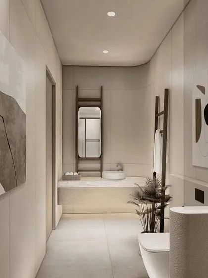 A bathroom in the Pavilions in the Fields project, where the clean lines of the vanity and fixtures are softened by abstract art. The long, linear space is designed to feel like a private gallery.