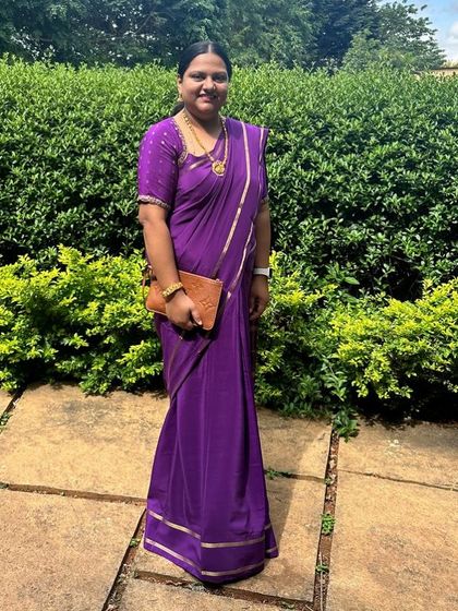 "Just looking like a wow." A client looking absolutely gorgeous in a purple pure Mysore crepe saree.