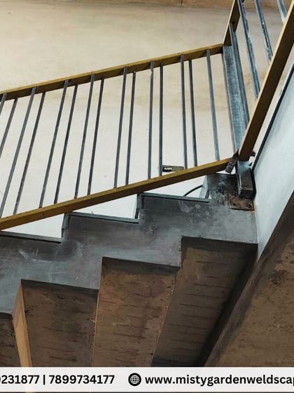 A close-up of the staircase railing's mounting point. I ensure every connection is securely welded and finished to provide a safe and sturdy structure that you can rely on.