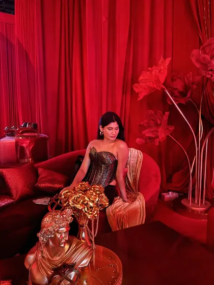 A moment of quiet amidst the chaos of the fashion show. The corset, with its intricate Indian-inspired pattern, was the hero piece of this look.