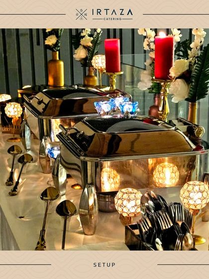 This silver and gold setup with crystal candle holders and red candles offers a classic and timeless look for any formal event.
