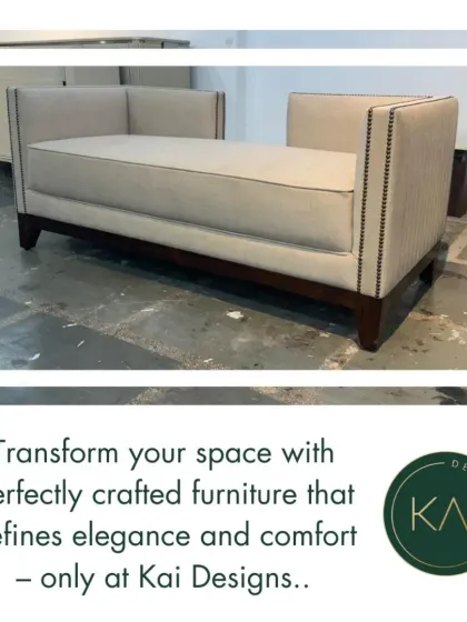 A custom-made daybed with high arms and nailhead trim detailing. This versatile piece was designed to function as both a stylish seating option and a comfortable resting spot in a multi-purpose room.