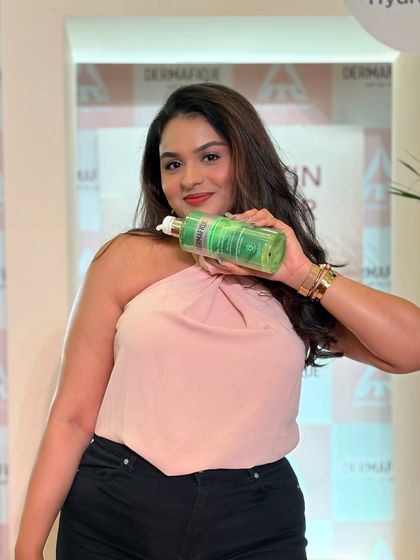 Posing with a hydrating product at a Dermafique event. It's always fun to connect with brands that focus on healthy skin.