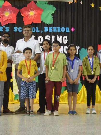 A group photo with the talented young artists and their medals at the closing ceremony of the St. Xavier's School summer camp.