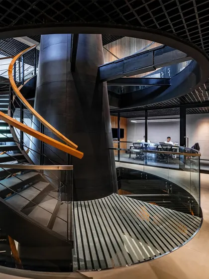 The central staircase at BCG HQ is a feat of engineering and design, appearing as a helical sculpture that anchors the entire office campus.