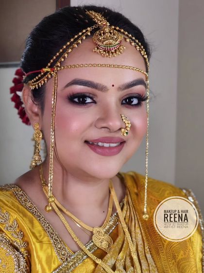 Gorgeous Shivangi, looking picture-perfect in her yellow and red wedding saree. I created a classic Maharashtrian bridal look with soft glam makeup and a traditional bun.