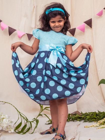 Another shot of the blue polka dot dress, perfect for a girl who loves to be the center of attention.