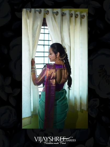 Our client Shravya Gowda on her engagement day, seen from the back to showcase the stunning fall of her aqua and purple Kanjivaram silk saree.