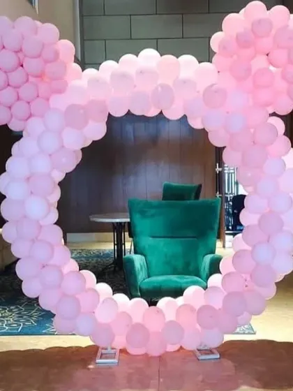 A fun and creative Mickey Mouse-shaped balloon arch in all pink. This unique frame is perfect for a Disney-themed party and serves as a fantastic photo booth.