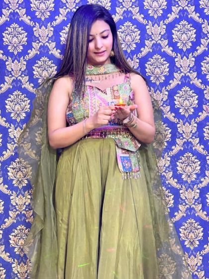A lovely sharara set in olive green with a colorful embroidered top. This is a great rental option for smaller festive occasions like Karwa Chauth or Diwali parties.
