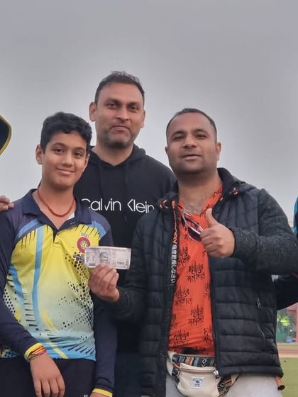 A player from our Delhi academy receiving a cash prize for his performance. We believe in rewarding hard work and excellence.