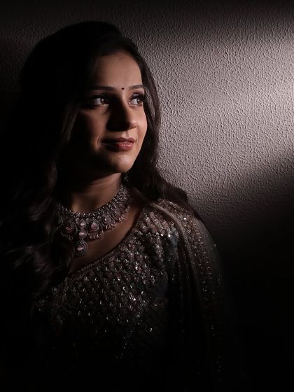 Playing with shadows and light to capture the elegance of this engagement look. Her profile looks absolutely stunning, highlighting the soft makeup and intricate jewelry.