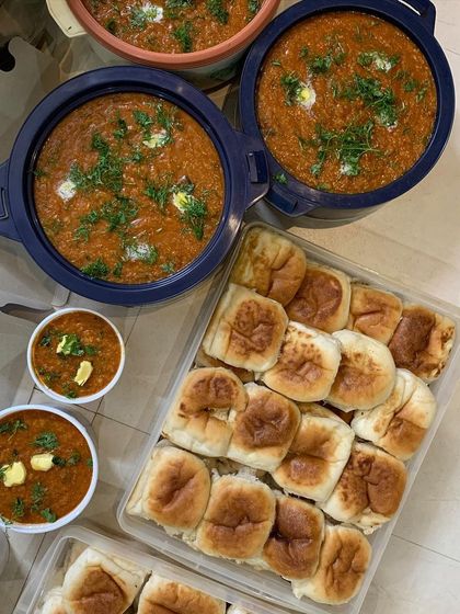 A large order of Pav Bhaji with soft pav buns, a favorite for parties and get-togethers.