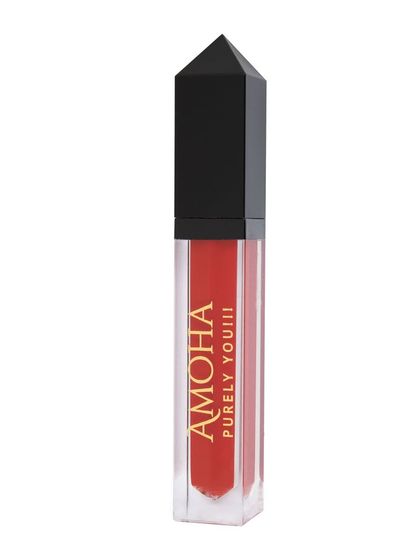 A tube of bright red-orange 'Amoha' lipstick on a white background.