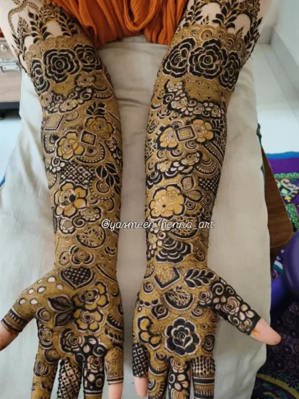 A beautiful example of a dense, full-arm bridal design where every inch is covered in art. The contrast between the dark and light shading gives it a wonderful texture.