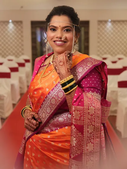 That happy smile says it all. I created this classic Maharashtrian bridal look with an emphasis on glowing skin and defined eyes, perfect for her wedding day.