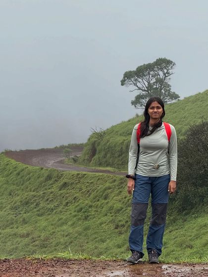 A trekker on a misty trail in Kodachadri, with a lone tree adding to the beautiful composition.