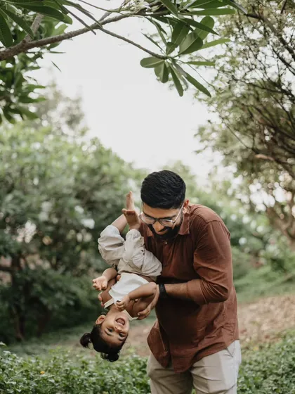 An outdoor session full of fun and play! This dad holding his daughter upside down resulted in the most joyful and authentic smiles.