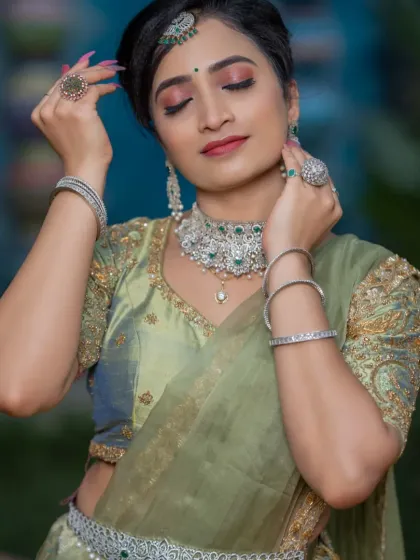 A student's work from their exam day, creating a beautiful pastel green lehenga look.