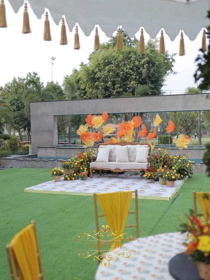 A wider view of the couple's stage, showing how it is positioned to take advantage of the beautiful venue backdrop.