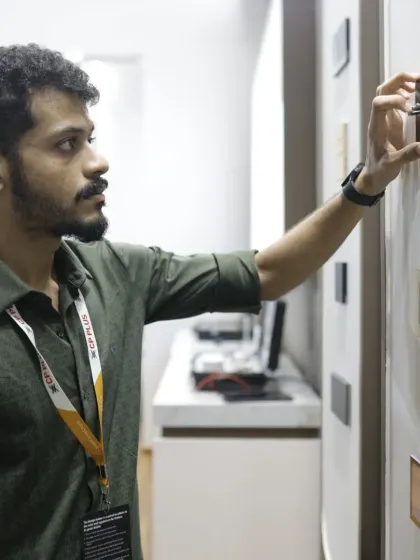 An attendee tests the feel and finish of a smart switch. The tactile experience is a crucial part of the evaluation process for architects and designers.
