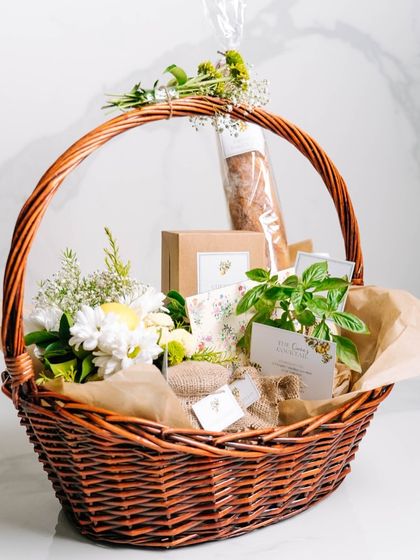 Say it with CAARA this Valentine's Day. This romantic wicker basket hamper is filled with fresh flowers, a basil plant, and a selection of our gourmet treats, making it a beautiful and thoughtful gift.
