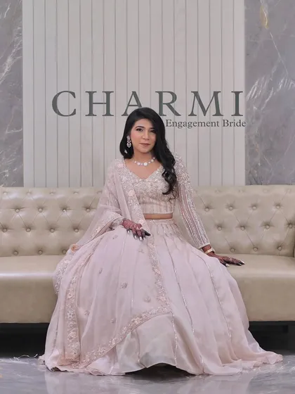 A classic portrait of the engagement bride. The simple, elegant backdrop allows her beautiful outfit and flawless makeup to take center stage.