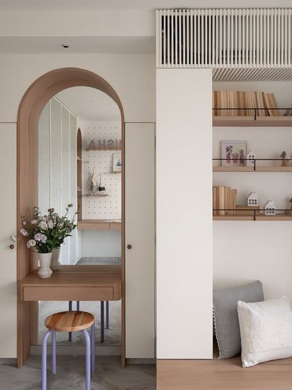 The Noir Blanc House kids' room shows a perfect balance of chic and naive interiors. This corner features an arched vanity and a reading nook with concealed storage, blending playful design with practical solutions.
