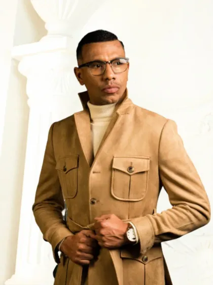 My outerwear collection redefines classic styles with a modern edge. This sophisticated military-inspired coat in a versatile camel hue is crafted from durable cotton twill and features functional cargo pockets and a belted waist for a structured, powerful silhouette.