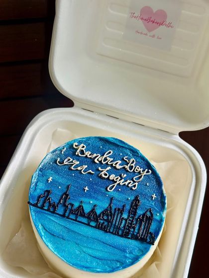 A hand-painted bento cake celebrating a move to a new city. This design features the Bandra-Worli Sea Link against a starry night sky, capturing a special moment.