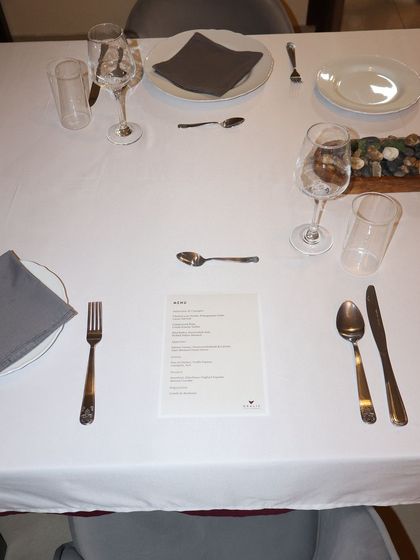 The menu awaits, promising a multi-course journey. Each tasting menu is custom-designed for the event, whether it's an anniversary dinner or an intimate supper club.