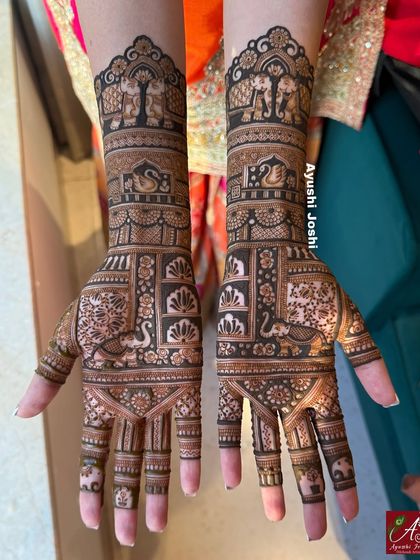 A short-length bridal mehendi design that is still grand, featuring elephants, swans, and intricate floral patterns.