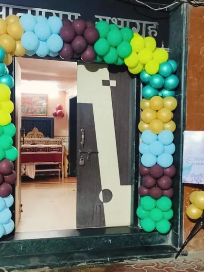A colorful balloon arch frames the doorway, creating a festive welcome for guests right from the entrance of the home.