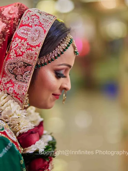 A moment of quiet reflection for the bride. The soft focus and side profile create a beautiful, contemplative portrait that feels both personal and timeless.