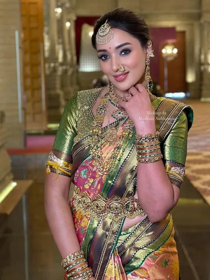 A smiling portrait that exudes confidence and the timeless beauty of a South Indian bride.