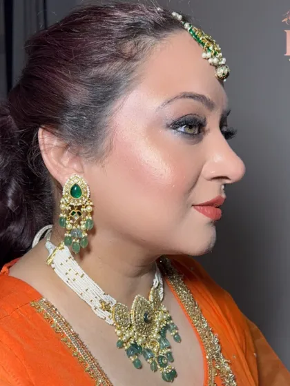 A side profile of the same client, showcasing the beautiful contour and highlight that gives her skin a youthful glow.
