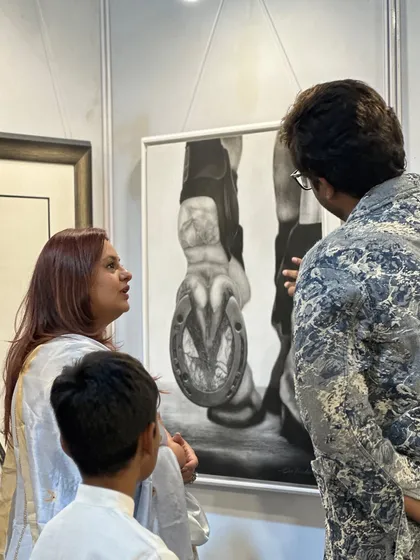 Explaining the details of my equine artwork 'Vigor' to Deepshikha Deshmukh ma'am during her visit to my exhibition.