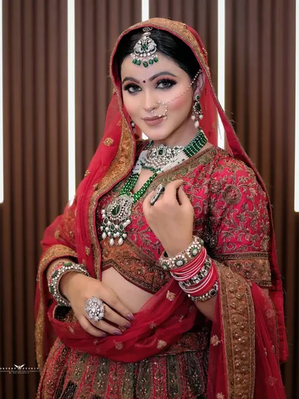 A three-quarter shot of the bride, showcasing her pose and the full blouse design.