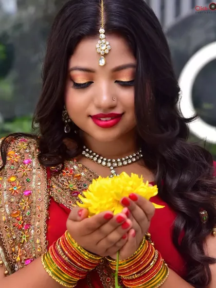A soft and delicate close-up, with the model holding a yellow flower. This adds a gentle, thematic element to the portfolio shoot, demonstrating a different mood.