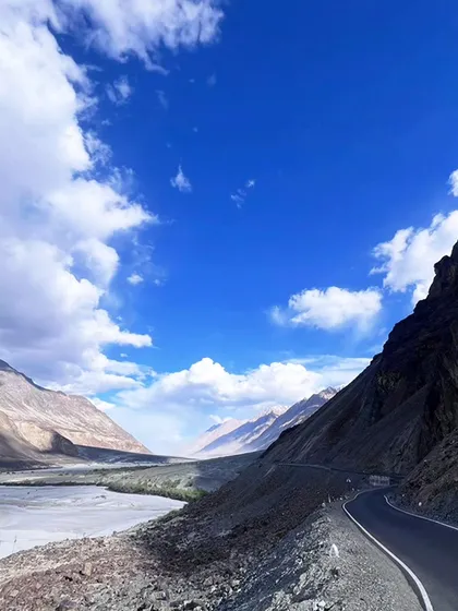 The open road calling your name. The journey through Ladakh's winding roads offers breathtaking views at every single turn.