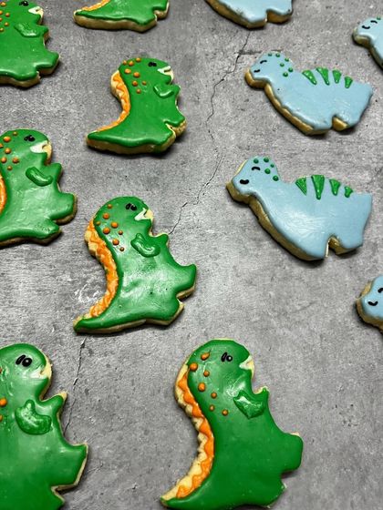 Roar! These dinosaur-themed cookies are always a hit at kids' birthday parties. Each one is hand-decorated to bring these cute creatures to life.